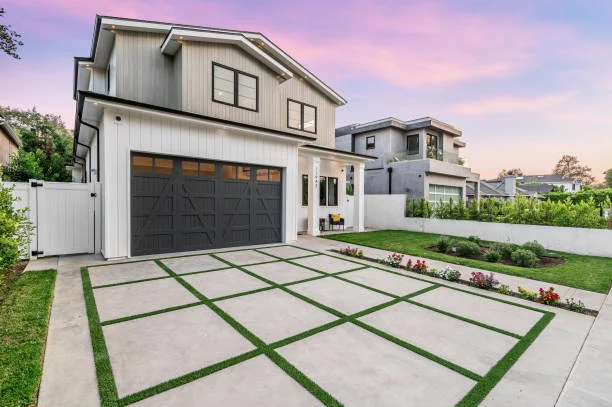 Modern white two-story house at sunset