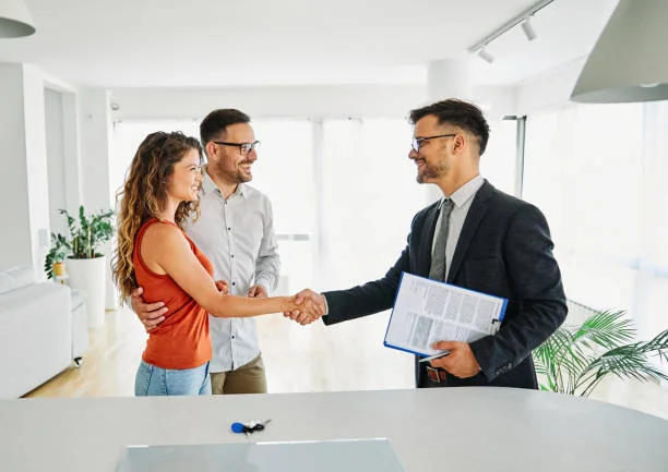 Property owners shaking hands with a property manager