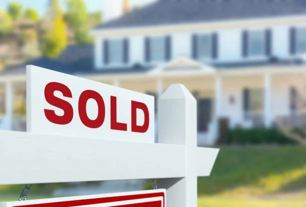 Sold sign in front of a house